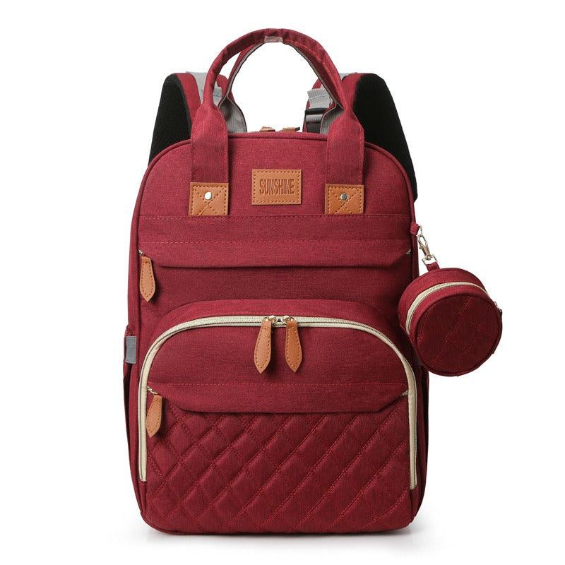 Red backpack with matching pouch on a white background