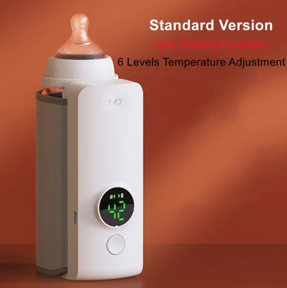 Baby bottle warmer with digital display on an orange background