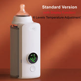 Baby bottle warmer with digital display on an orange background