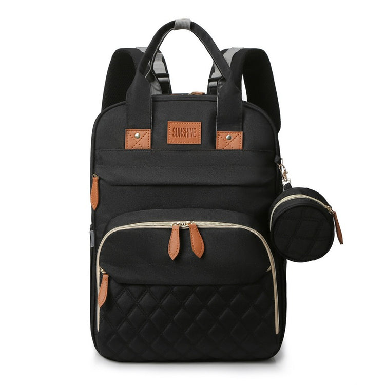 Black backpack with quilted design and brown accents on a white background
