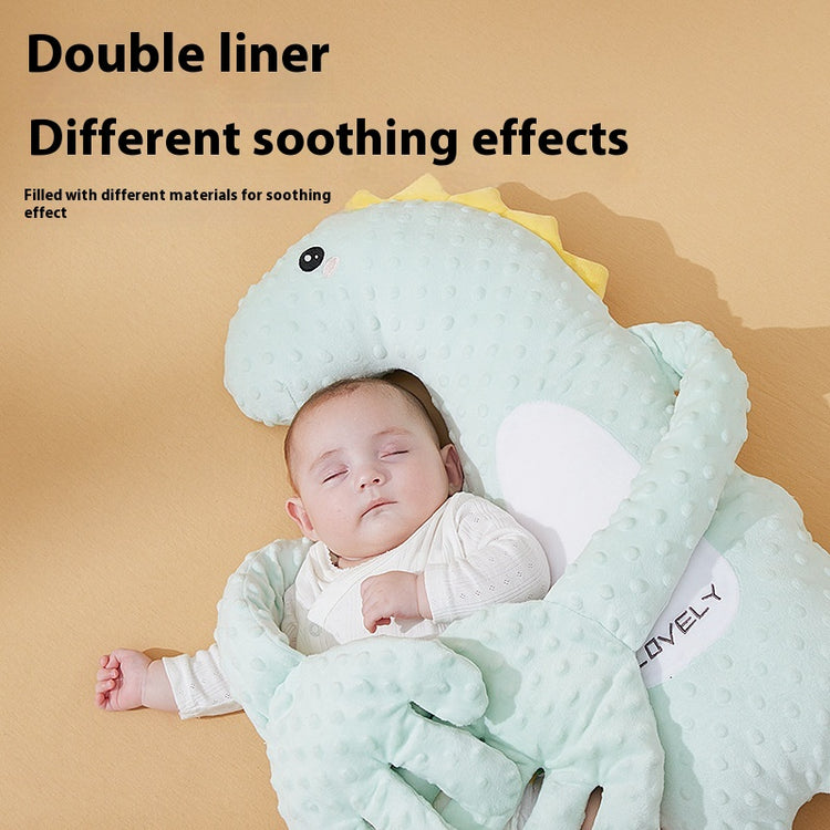 Baby sleeping under a dinosaur-shaped comfort blanket with text about double liner and soothing effects.