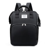 Black backpack with a visible brand label on a white background