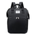 Black backpack with a visible brand label on a white background