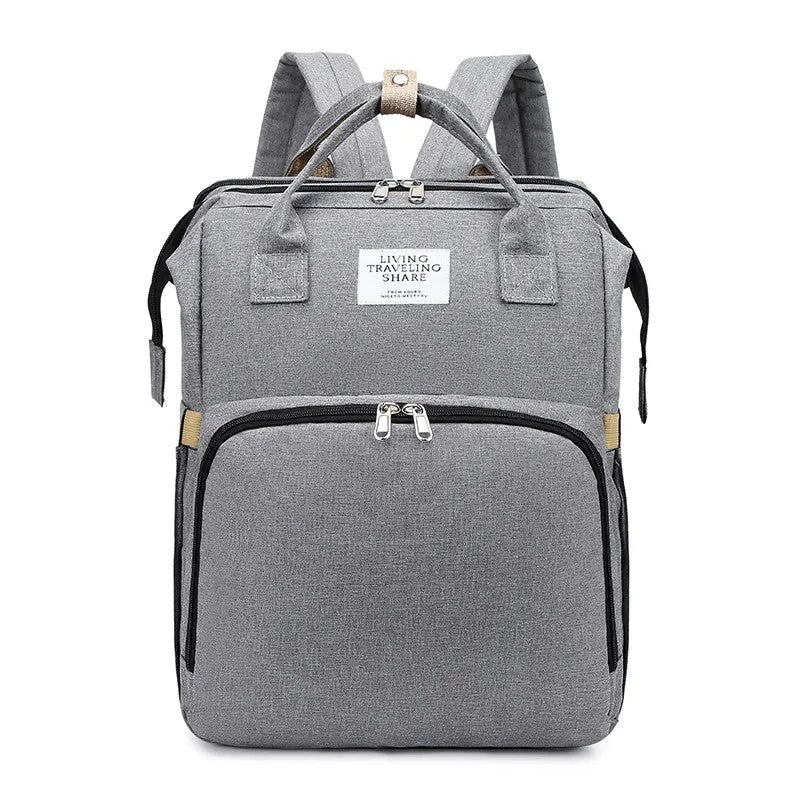 Gray backpack with visible brand label on a white background