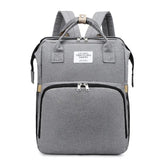 Gray backpack with visible brand label on a white background
