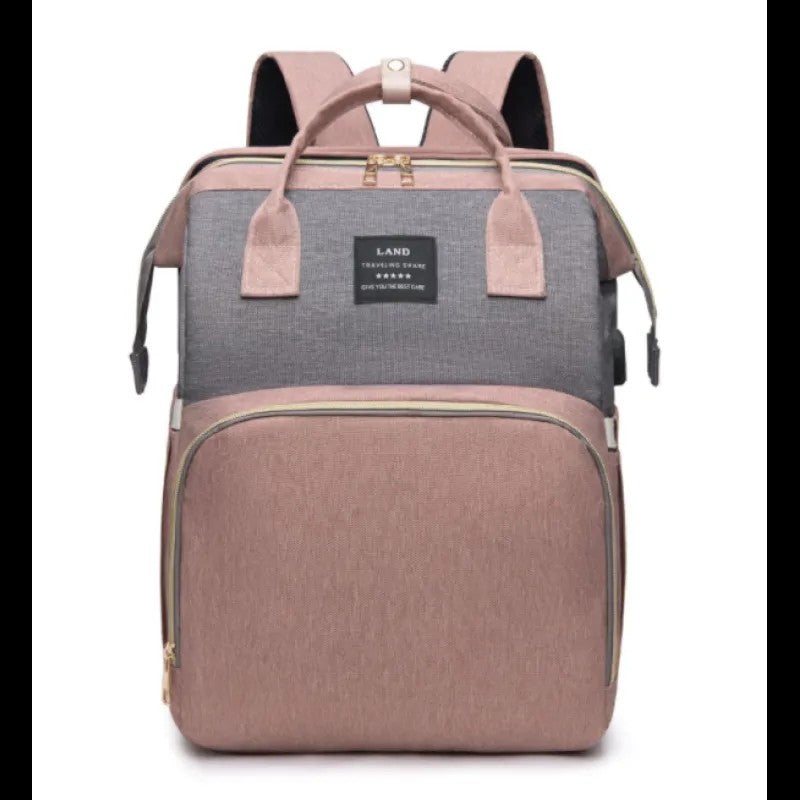 Two-tone backpack with gray top section and pink bottom section on a white background