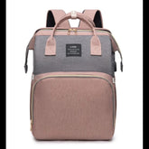 Two-tone backpack with gray top section and pink bottom section on a white background