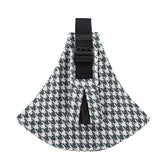 Houndstooth patterned dog harness with a black buckle on a white background