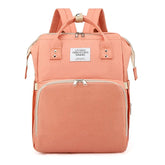 Peach-colored backpack with gold accents on a white background