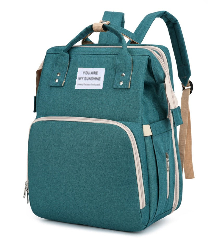 Teal backpack with a label on a white background
