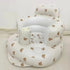 White inflatable baby seat with bear pattern on a white background