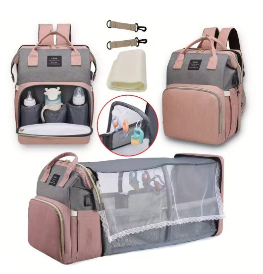 Multifunctional diaper bag with organizer, changing mat, and baby accessories on a white background