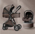 Brown baby stroller and car seat set on a tiled floor with a textured wall background.