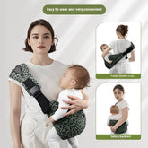 Woman holding a baby in a green baby carrier with text highlighting features.